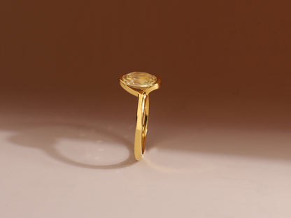 Open setting bezel sapphire ring